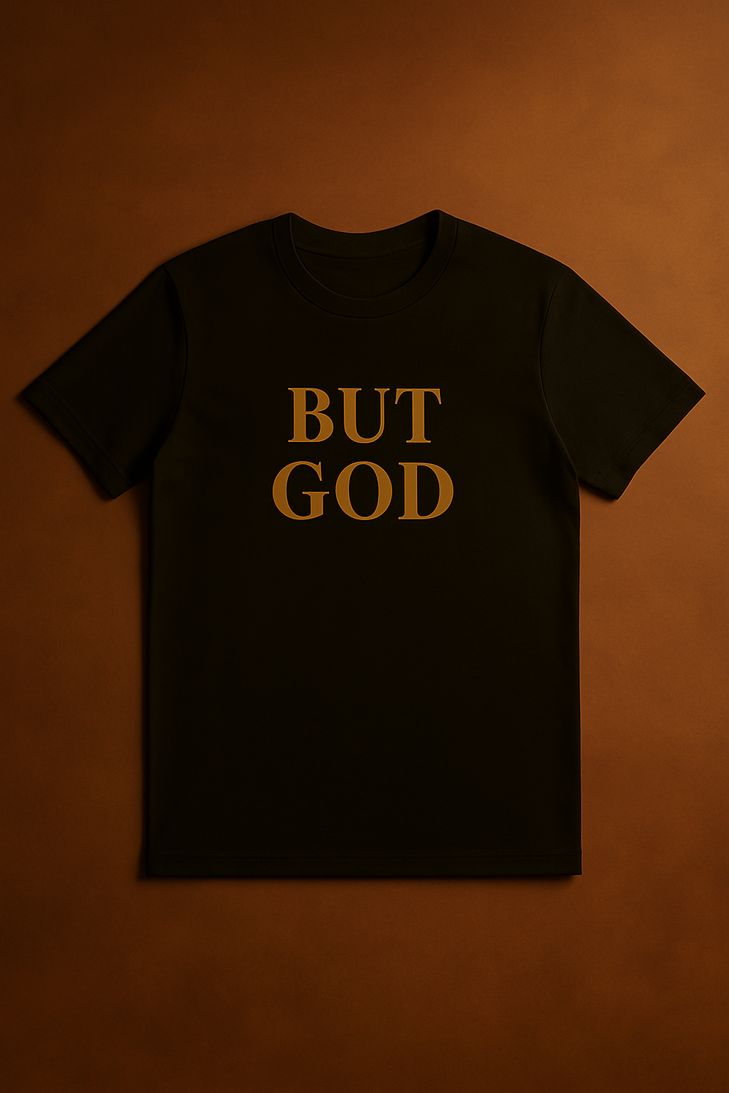 Black “BUT GOD” Christian t-shirt with metallic gold print on brown background